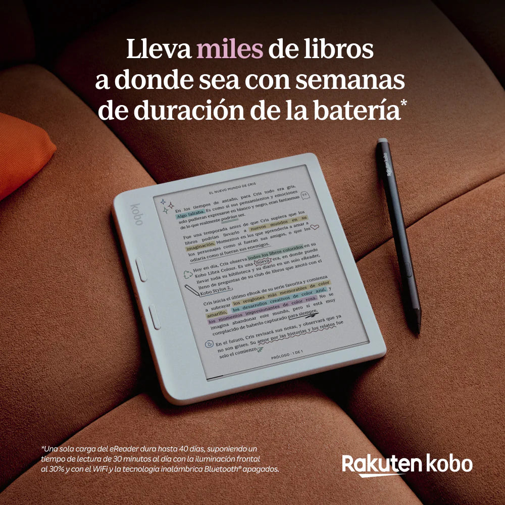 El eReader Kobo Libra Color 32GB Negro con pantalla a color E Ink descansa sobre un sofá junto a un bolígrafo, mostrando un libro subrayado y anotado. Destacan su batería de larga duración y 32 GB de almacenamiento para millas de libros.